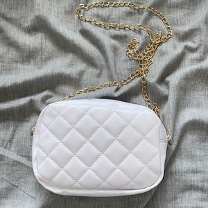 white leather purse with gold chain